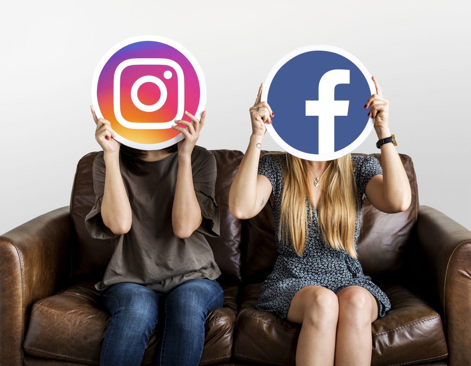 Social media evaluators holding Facebook and Instagram icons